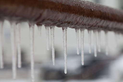 A frozen pipe outdoors.